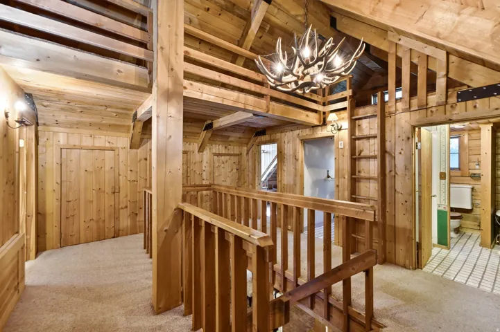 Wood-paneled interiors with exposed wood beams