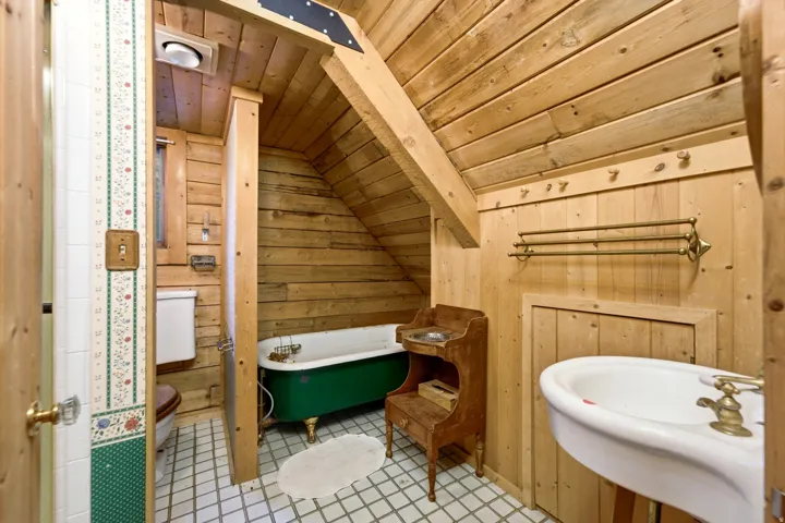 Sloped wood-finish ceiling and wall paneling