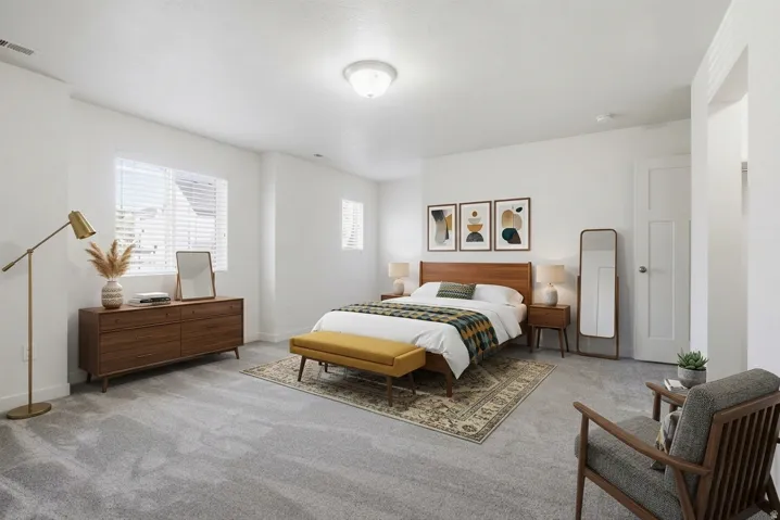 Neutral wall finishes, recessed lighting, expansive carpeted flooring, and a multi-pane window with horizontal blinds