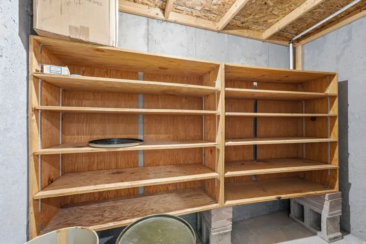 Open wood-finish shelving with multiple compartments