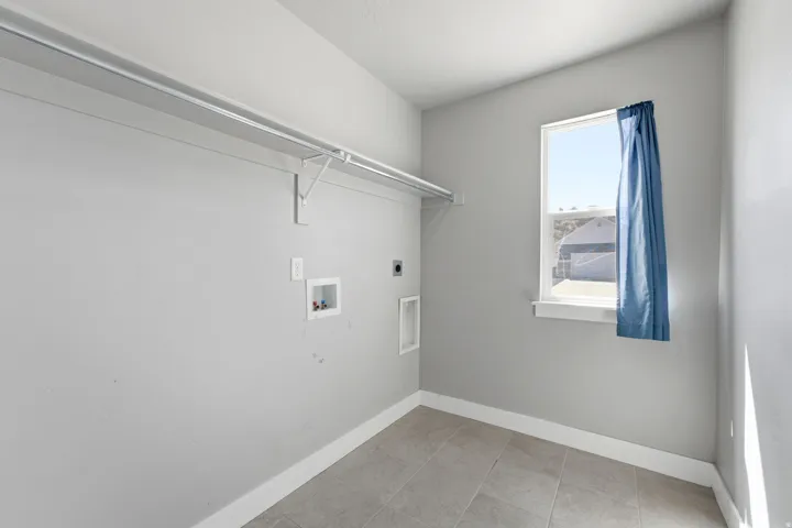 Utility connections, built-in shelving, and a single window