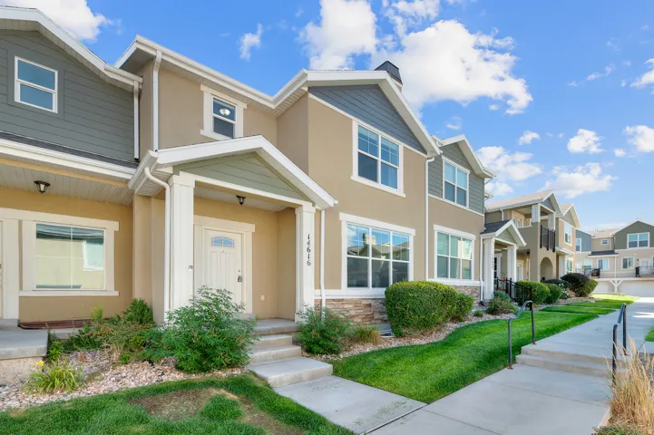 Multi-level exterior featuring stucco and siding finishes
