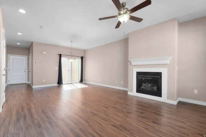 Wood-finish flooring, recessed lighting, and a ceiling fan