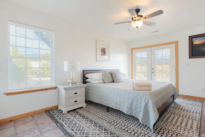 White walls with wood trim and tile flooring