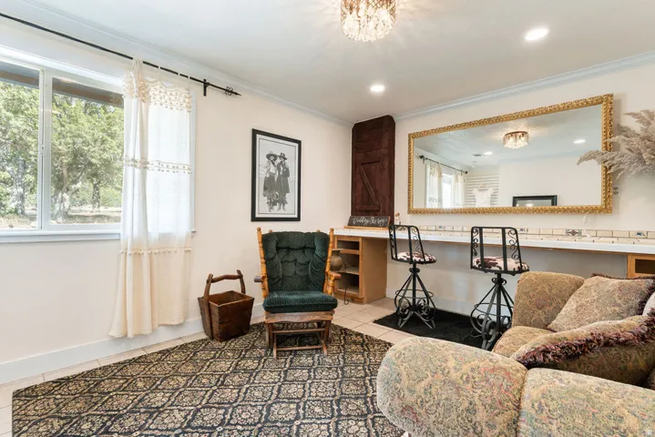 Recessed lighting, crown molding, and tiled flooring