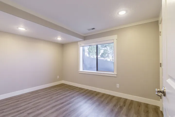 Recessed lighting illuminates neutral-toned walls