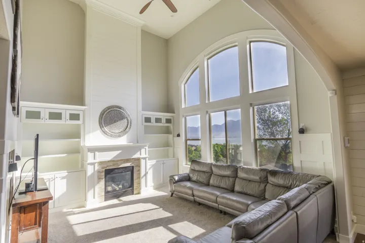 High ceilings complemented by expansive arched windows and stunning views of the lake, mountains and valley.
