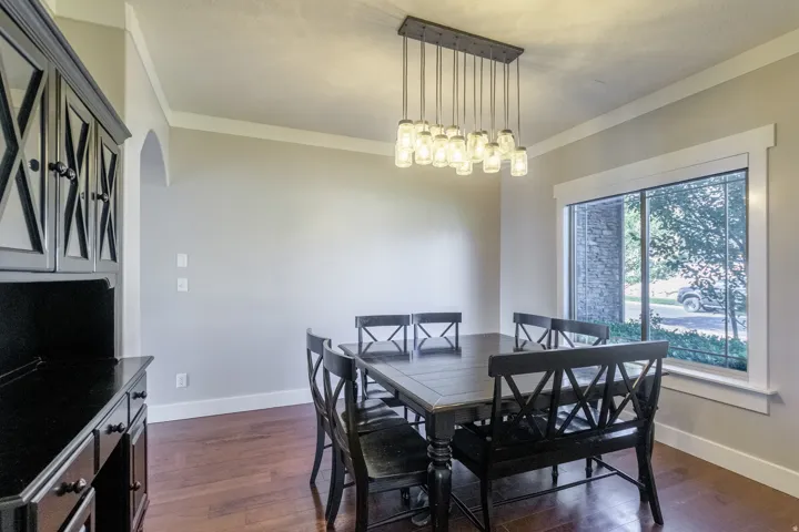 Wood-finish flooring with crisp white baseboards