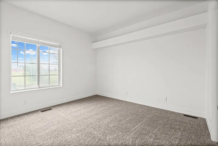 Primary bedroom with direct bathroom access.