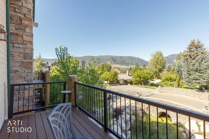 North balcony with wood-finish decking and black metal railings