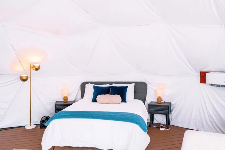 Geodesic dome interior with wood-finish flooring