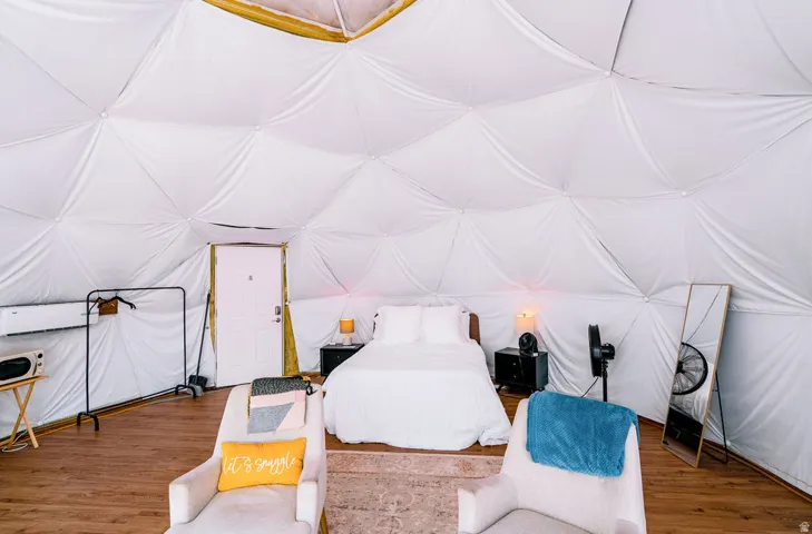 Geodesic dome interior with wood-finish flooring
