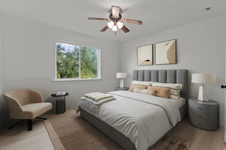 Recessed window with white trim, wood-finish flooring, and a ceiling fan with integrated lighting