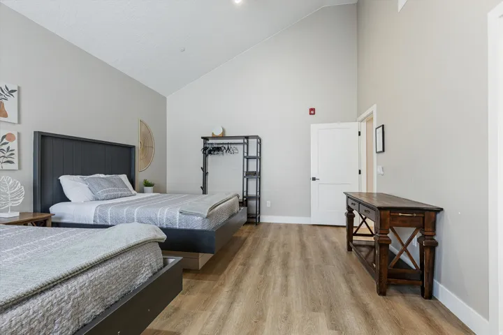 Vaulted ceilings, wood-finish flooring, and white trim