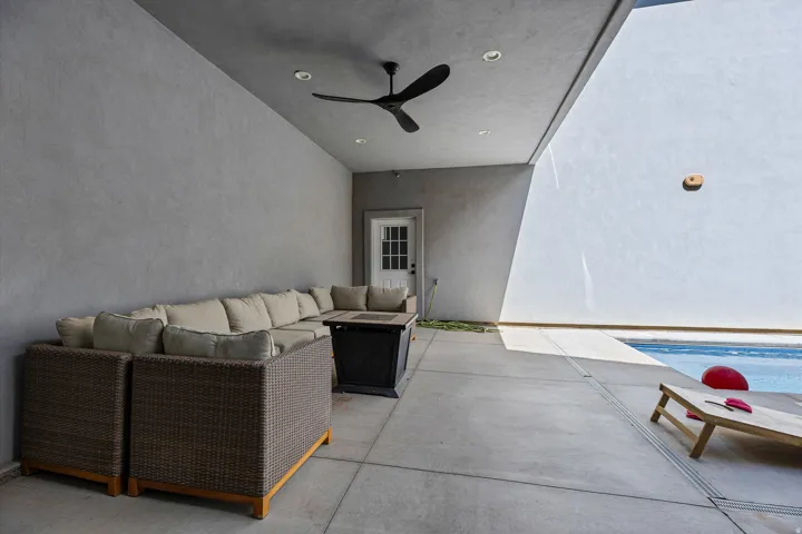 Covered patio with recessed lighting, ceiling fan, and concrete flooring