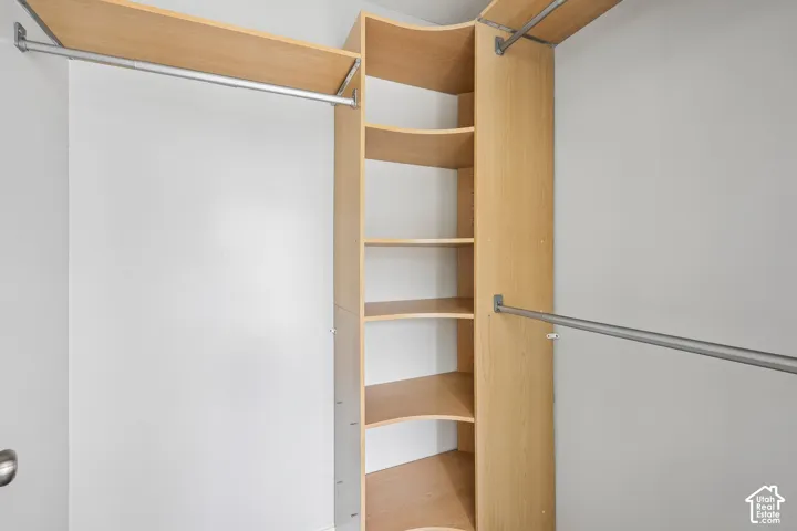 Built-in closet system featuring multiple shelves and hanging rods