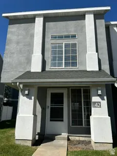 Stucco exterior with prominent white architectural columns