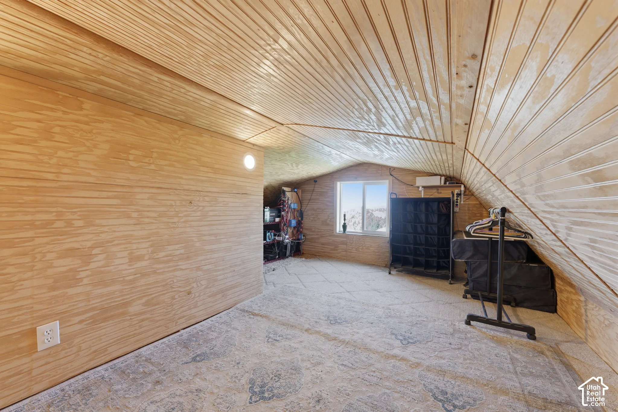 Plywood wall paneling with a single built-in light fixture