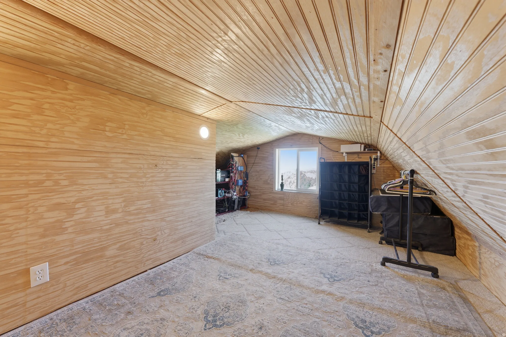 Plywood wall paneling with a single built-in light fixture