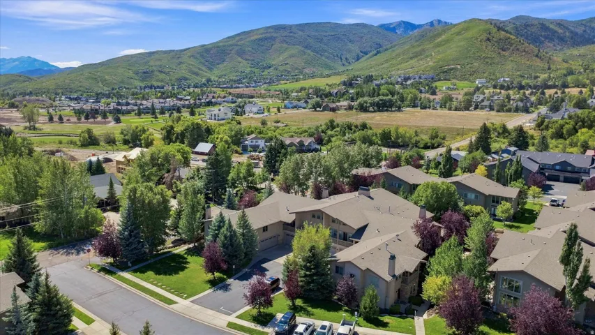 Residential neighborhood with mature trees and maintained landscaping