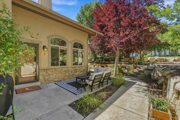 Stucco exterior with stone veneer accents