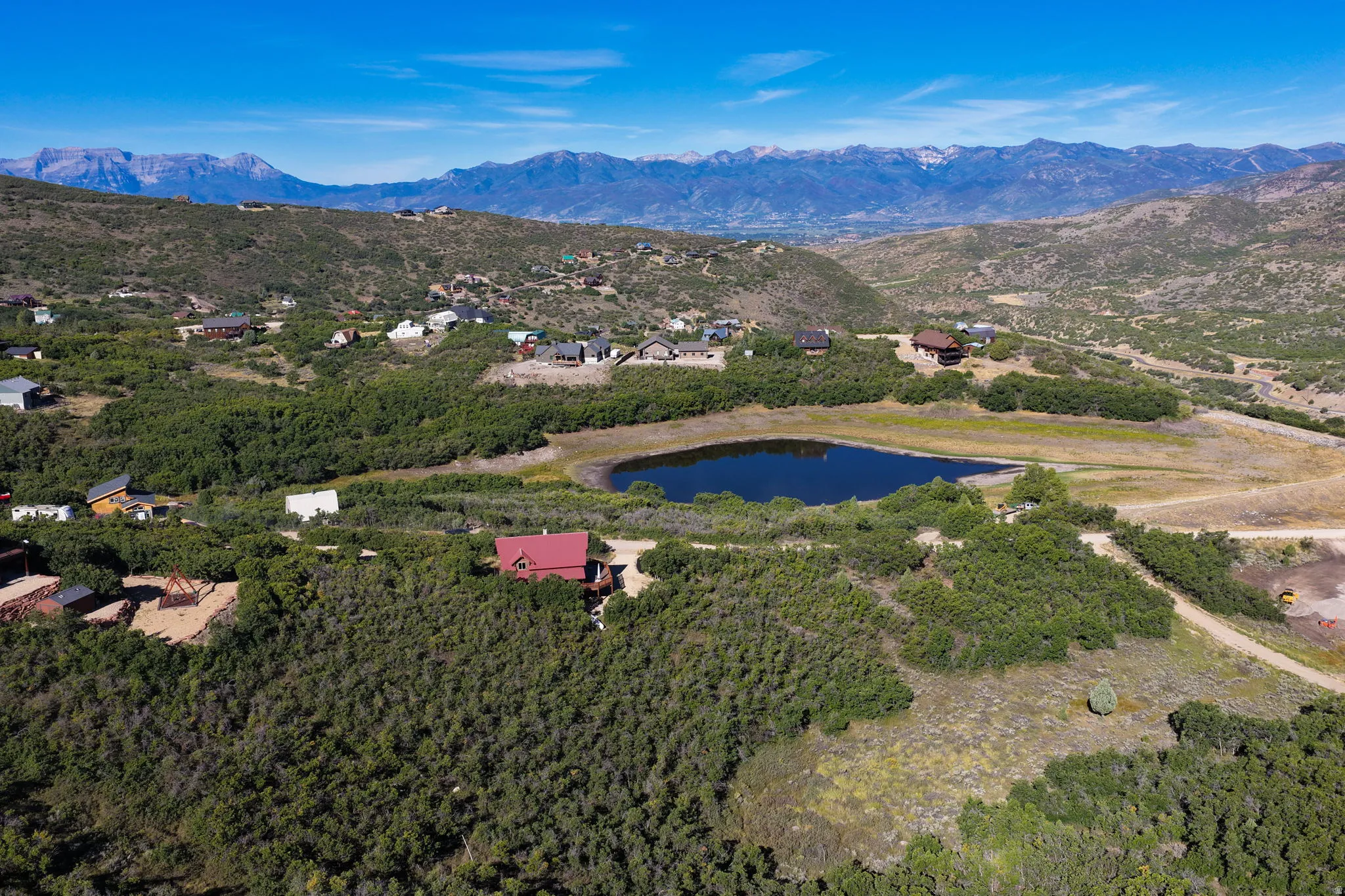 Rural setting featuring a prominent lake and distant mountain range