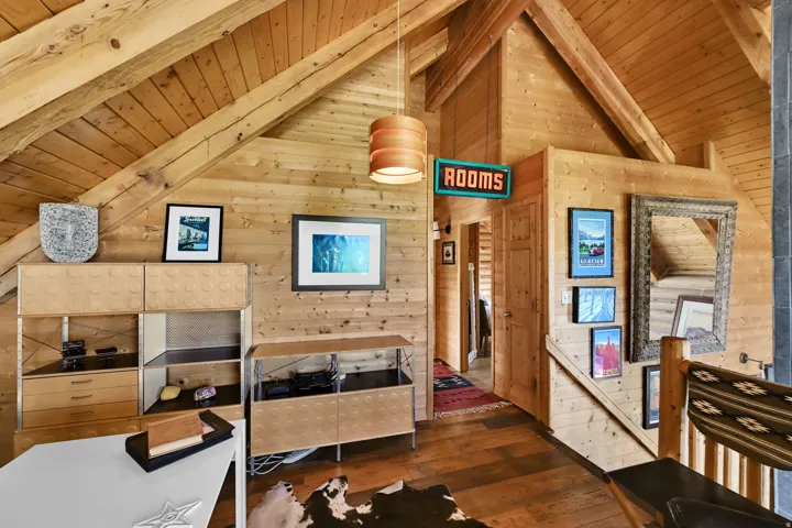 Vaulted wood-paneled ceiling with exposed beams