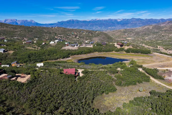 Rural setting featuring a prominent lake and distant mountain range