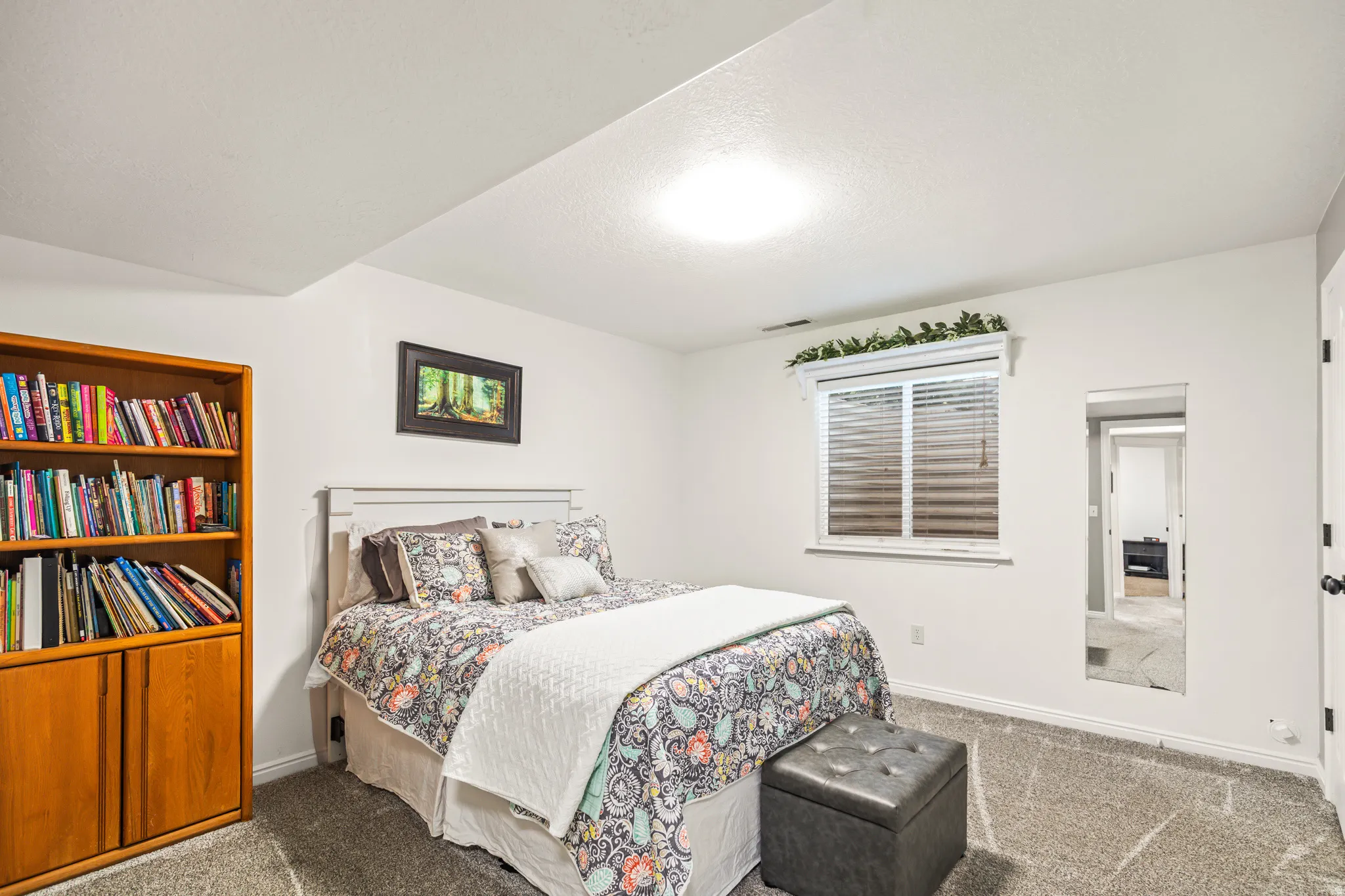 White painted walls and gray carpet flooring