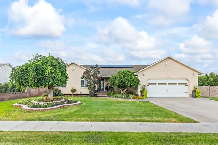 Single-story residence featuring a stucco exterior and an attached two-car garage