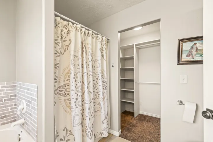 Recessed closet with built-in shelving and hanging rod