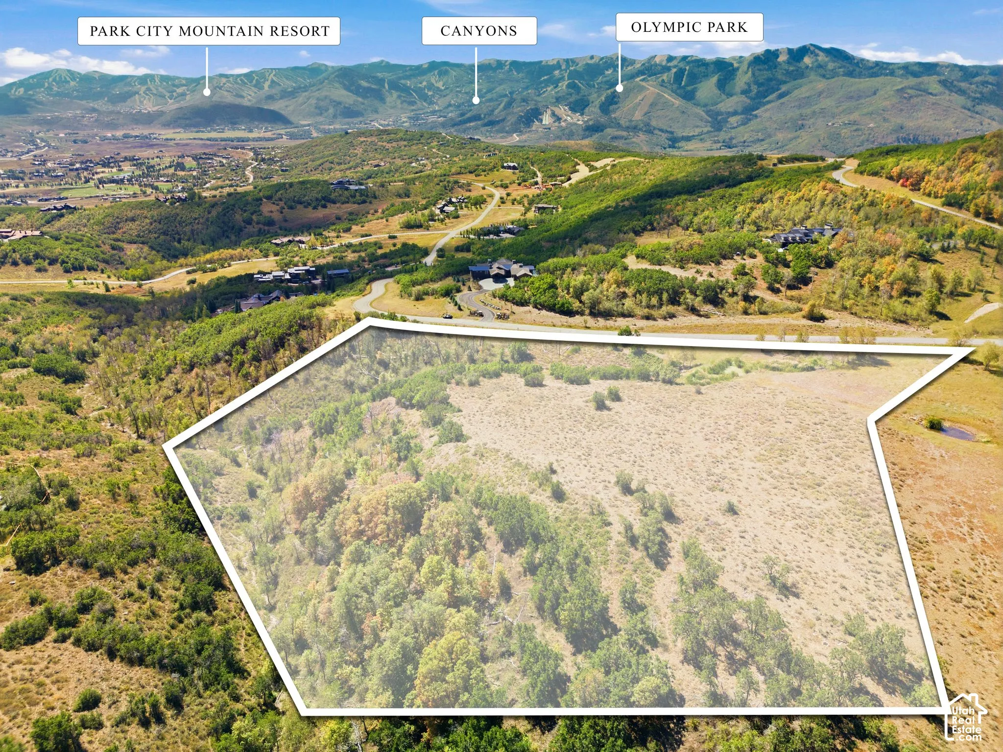Expansive undeveloped acreage featuring native mountain vegetation, rolling topography, and prominent mountain backdrops