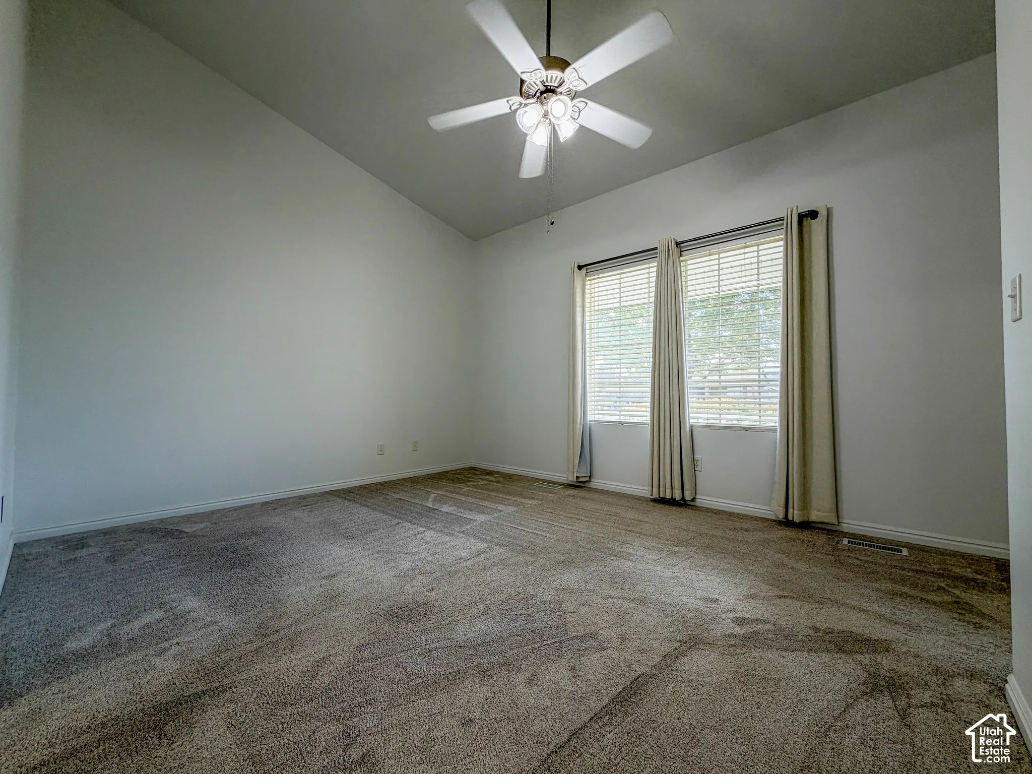 Vaulted ceiling with an integrated ceiling fan and light fixture