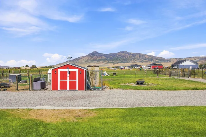 Red shed with white trim and double doors