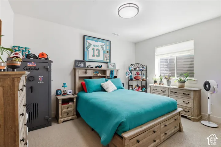 Recessed window with privacy blinds, neutral wall paint, and a built-in overhead light fixture