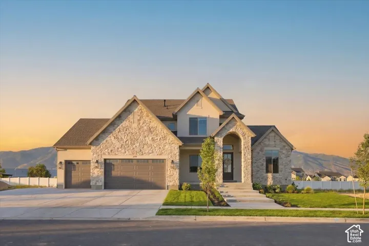 Stone and stucco exterior with multiple gables