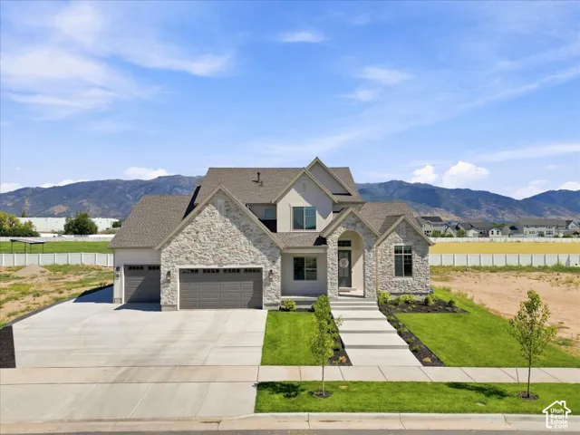 Stone and stucco exterior with a multi-gabled roof