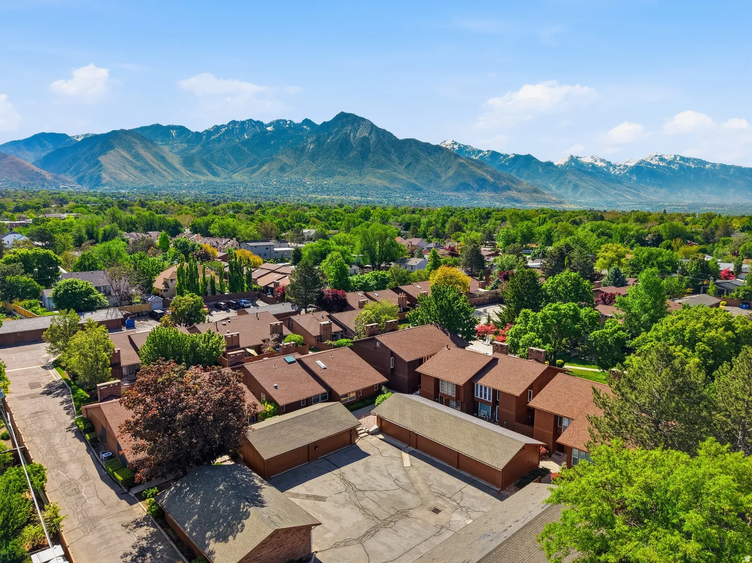 Expansive mountainous backdrop frames the community