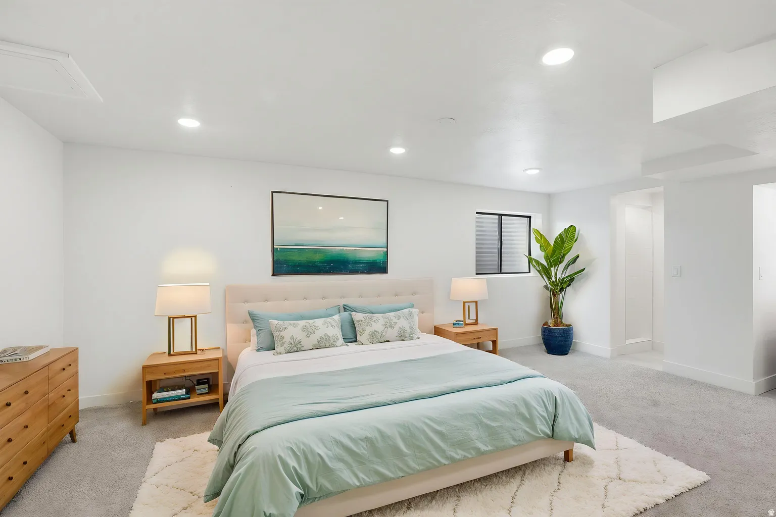 Recessed lighting throughout, wall-to-wall carpeting, and a window with horizontal blinds