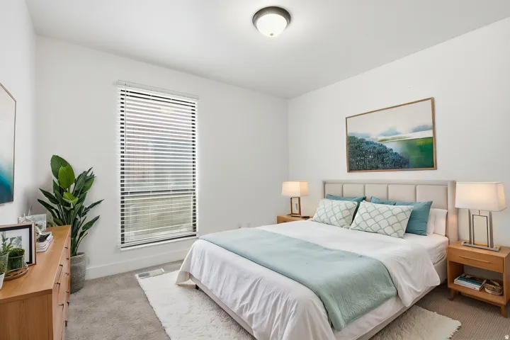 Recessed lighting, window with horizontal blinds, carpeted flooring, and light-toned walls