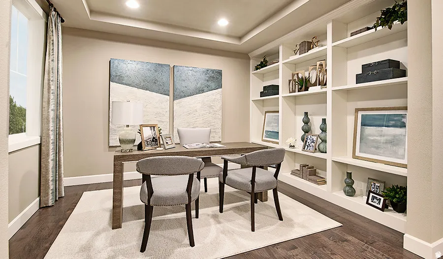 Built-in shelving, tray ceiling, recessed lighting, wood-finish flooring, and a large window