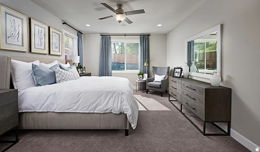 Spacious room with plush carpeting, recessed lighting, and a ceiling fan