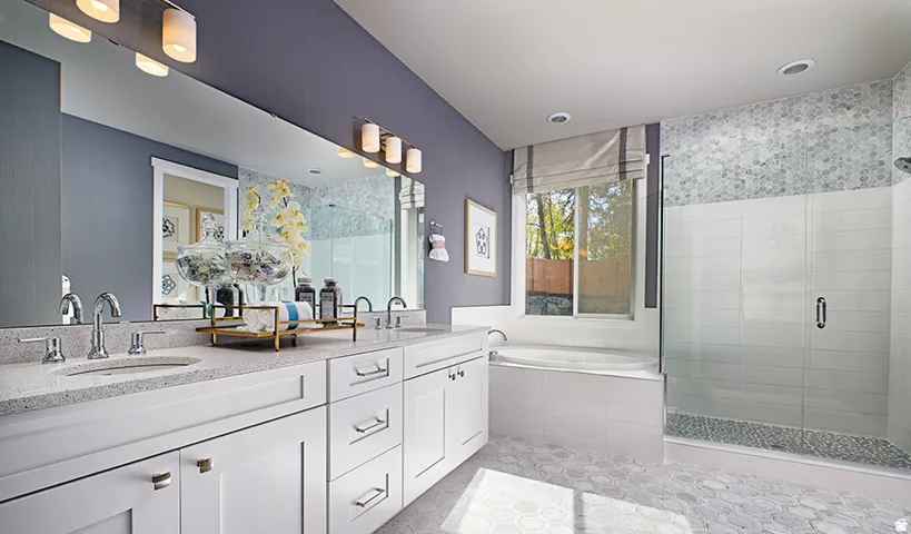 Dual vanity with undermount sinks and light-toned countertops