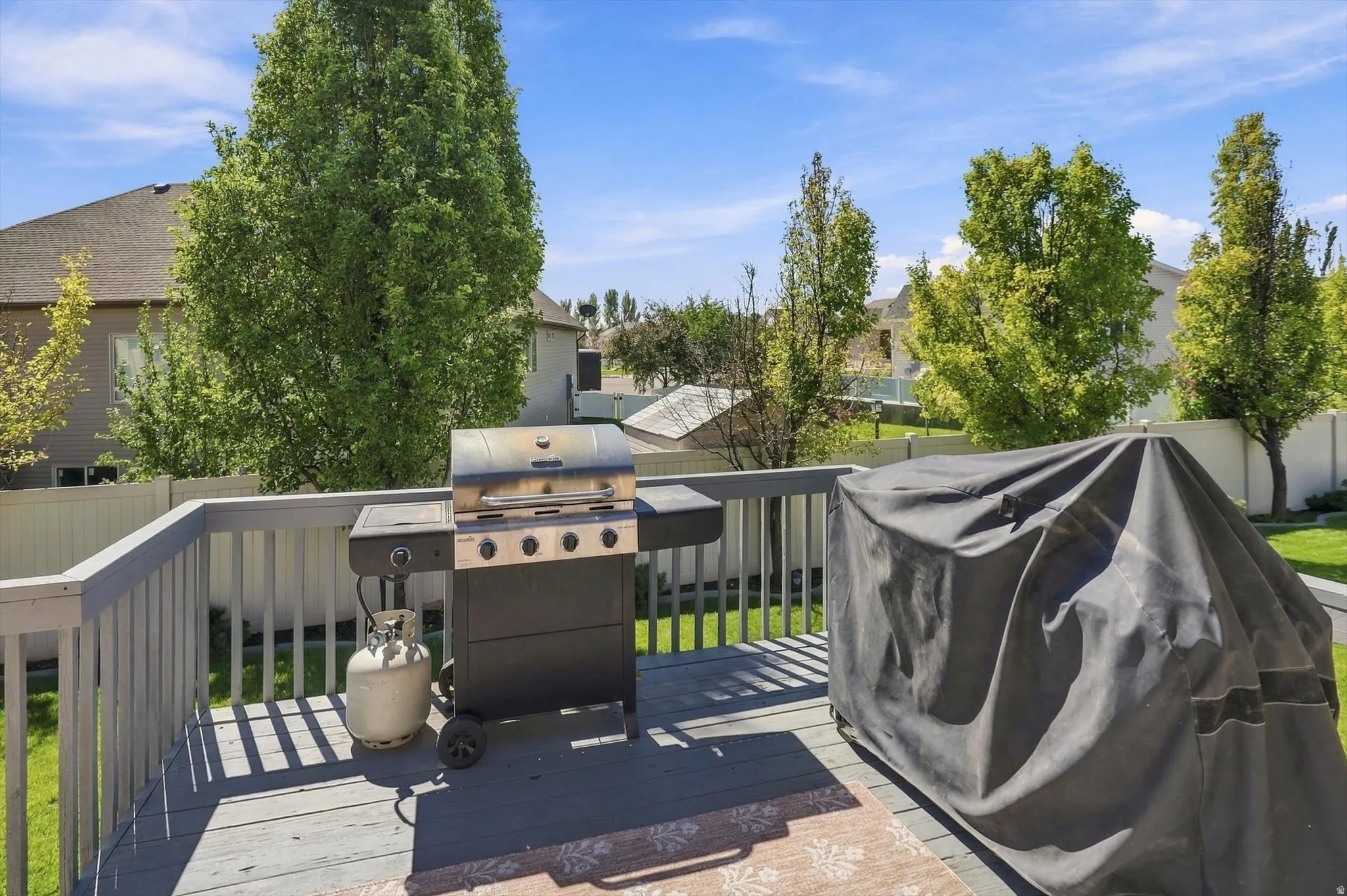 Spacious outdoor deck with railings and ample room for entertaining