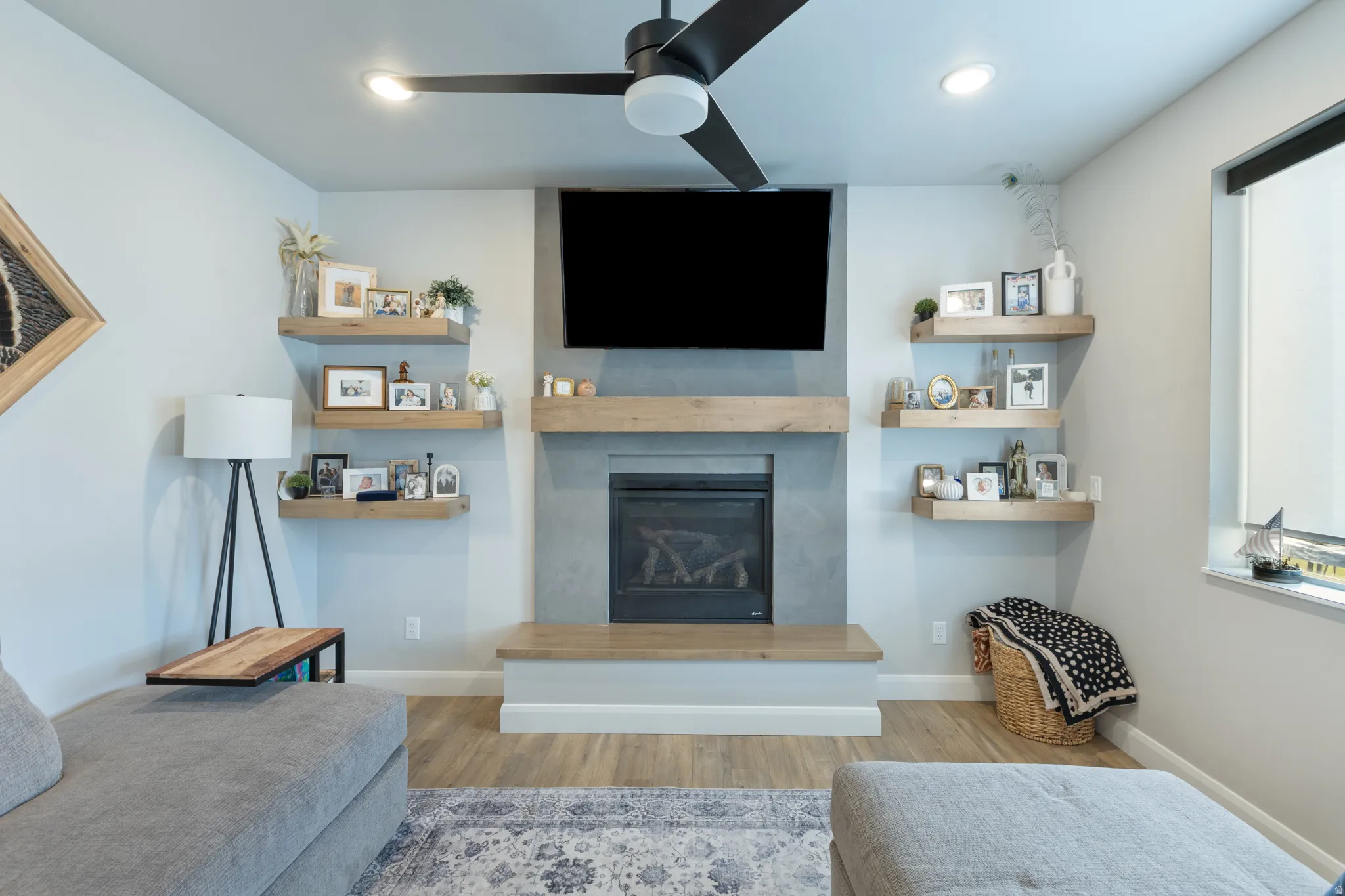 Wood-finish flooring, recessed lighting, and a ceiling fan