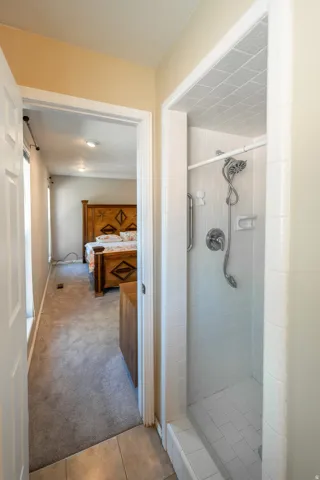 Tile shower with chrome fixtures