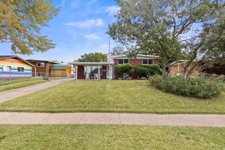 Fantastic brick home with white window trim and a manicured front lawn - Call for your showing today!