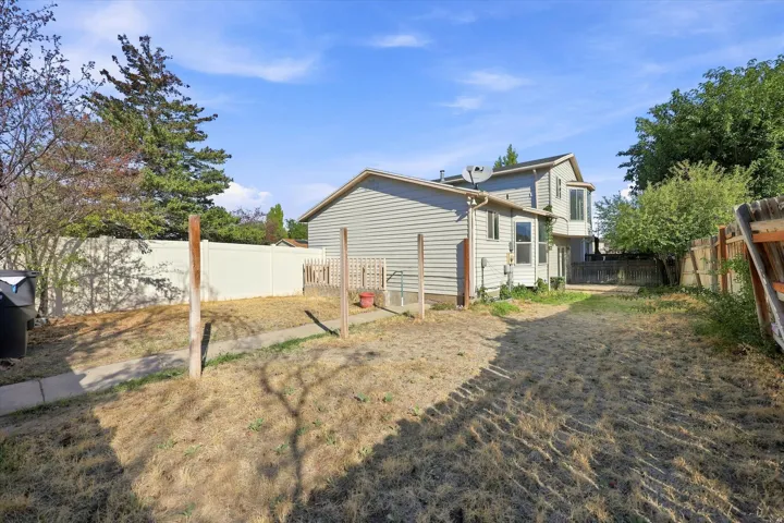 Exterior featuring horizontal siding, multiple windows, and a bay window