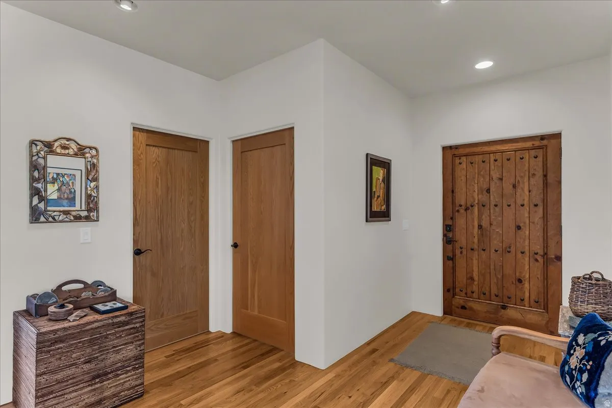 Foyer with Solid Wood Doors and Hardwood Flooring