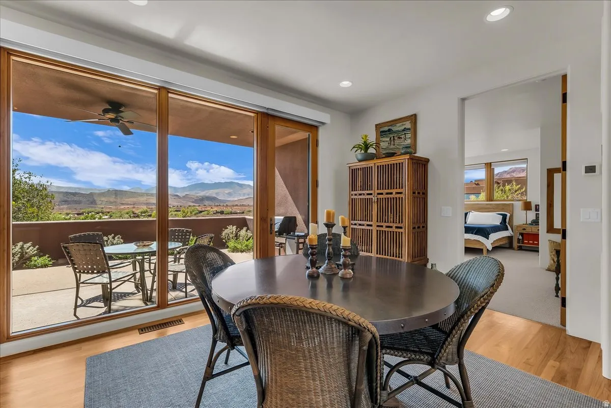 Dining Room with Expansive Glass Doors Opening to a Private Patio